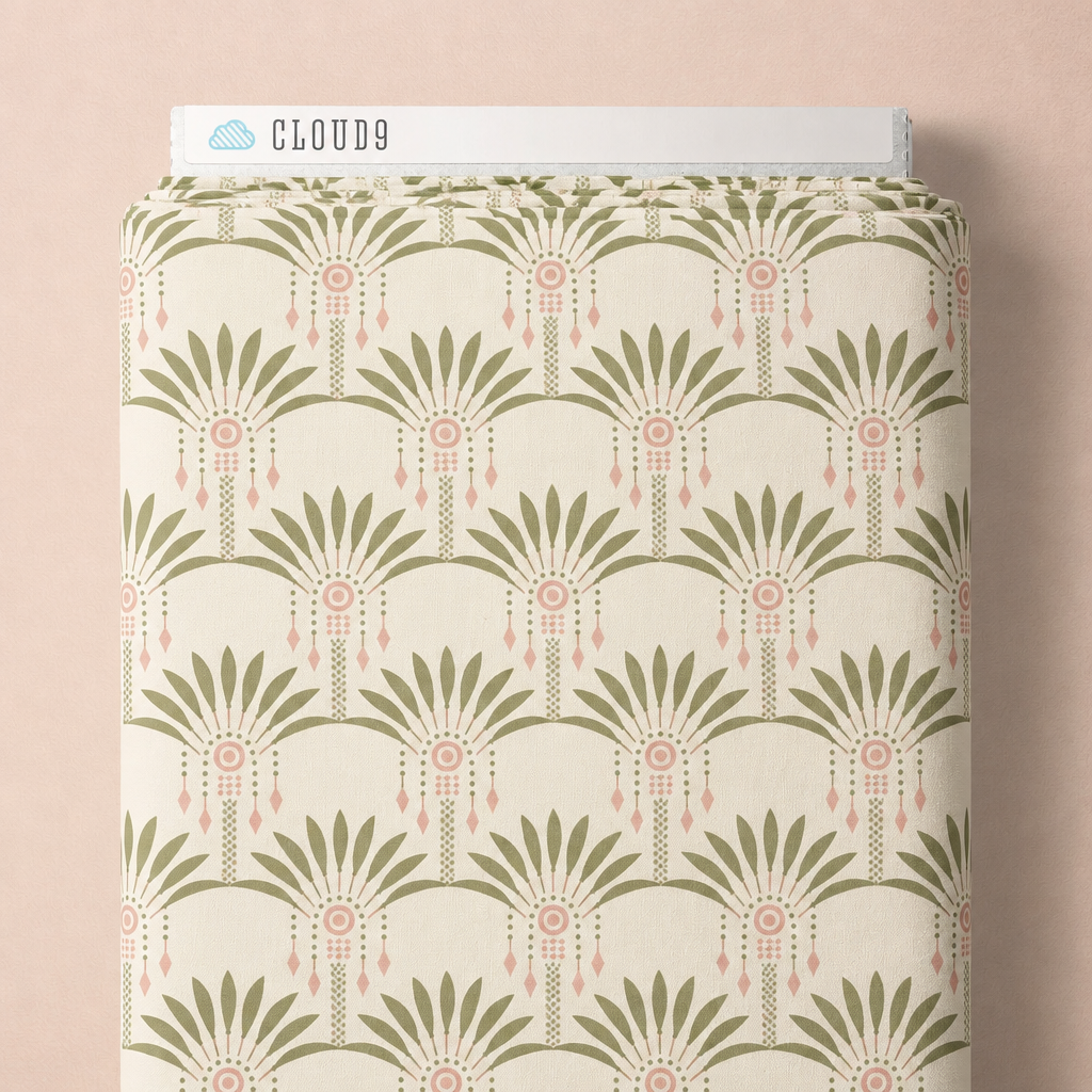 Art Deco Palms fabric styled on a bolt against a peach background